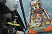 Crashed AirAsia’s Tail Hoisted From Sea in Search of Black Boxes
